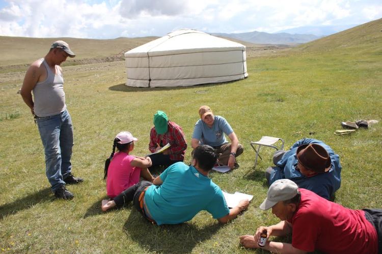 Katey speaks with herders in Mongolia. Image courtesy Katey Duffey.