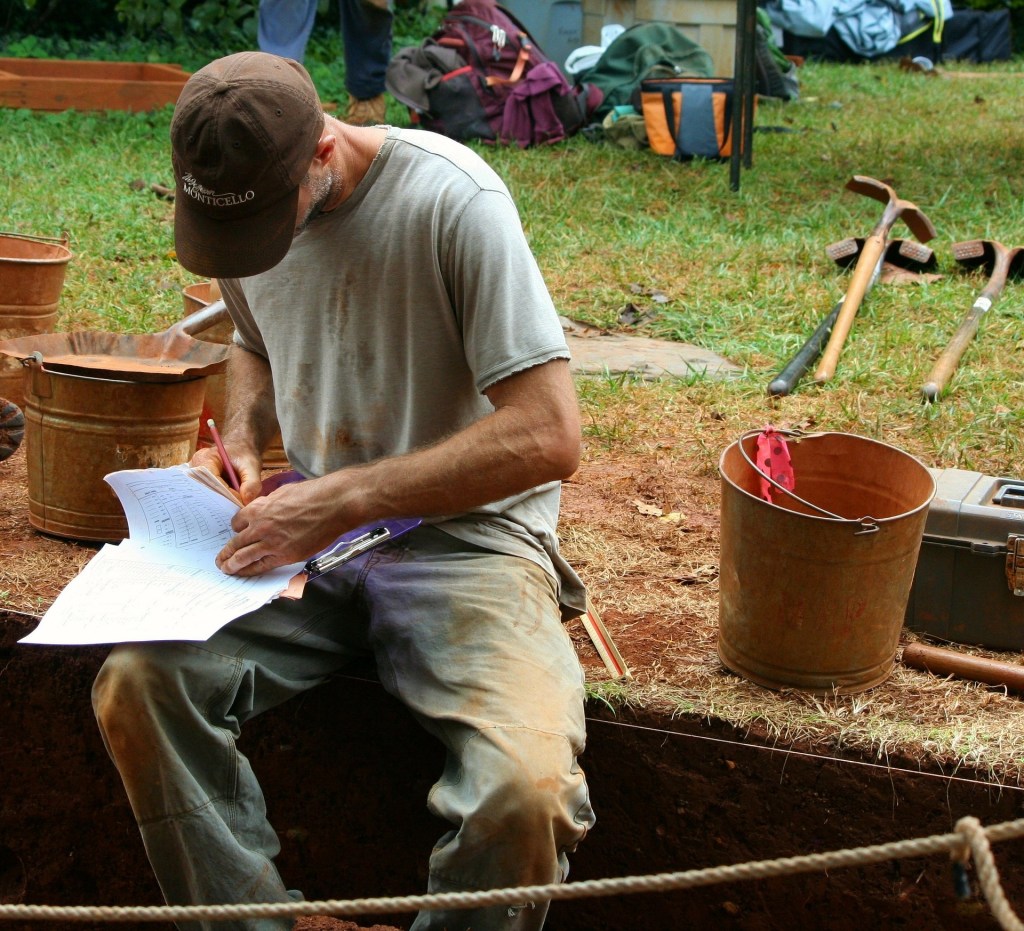 An archaeologist working on an excavation.