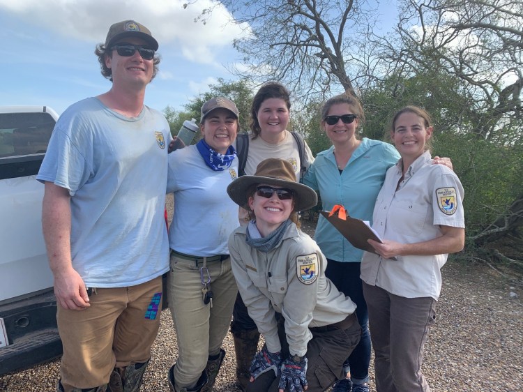 A group of conservation professionals, including Dr. Wilcox.